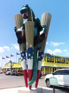 Dinosaur dressed as a cowboy